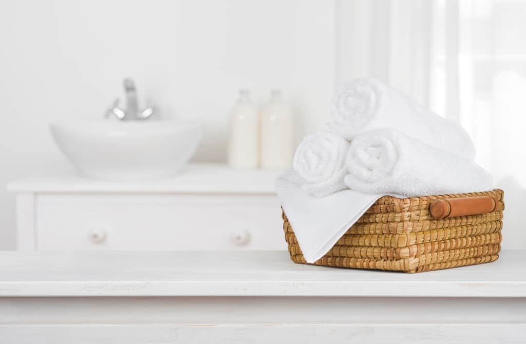 bathroom with sink and towels in a basket