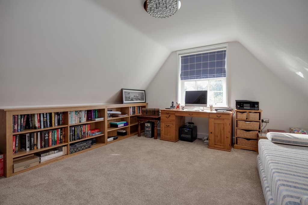 low shelving in the bedroom with slanted walls