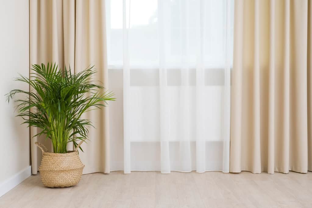 living room with curtained window