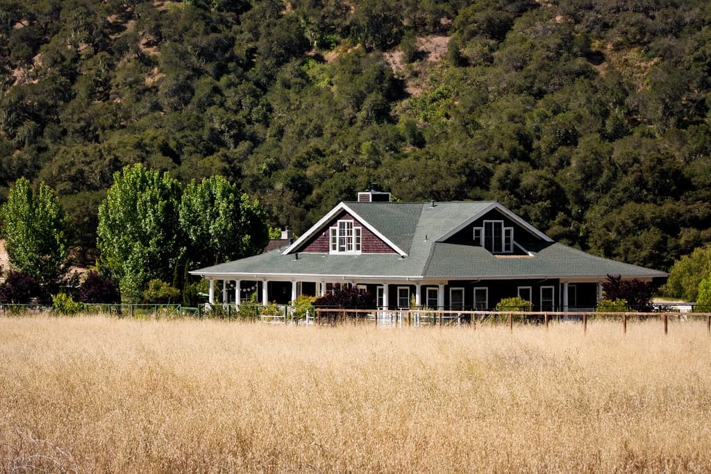 ranch house on rural property in the foreground