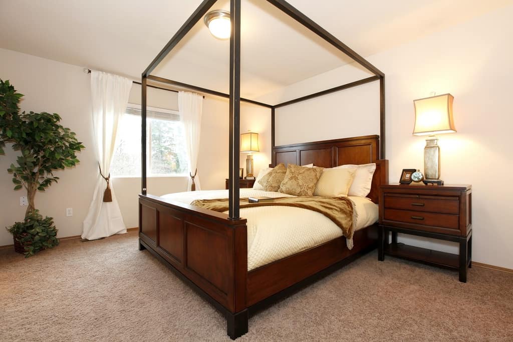 white color bedroom with cherry furniture