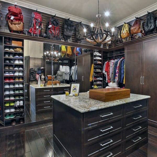 organized-mens-closet-with-island-cabinet-in-middle-of-room