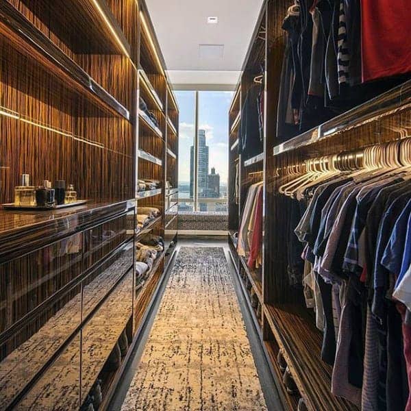 penthouse-mens-modern-closet-design-with-skyline-view-from-window