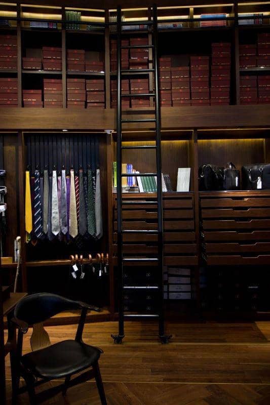 two-story-closet-with-ladder-and-wood-shelf