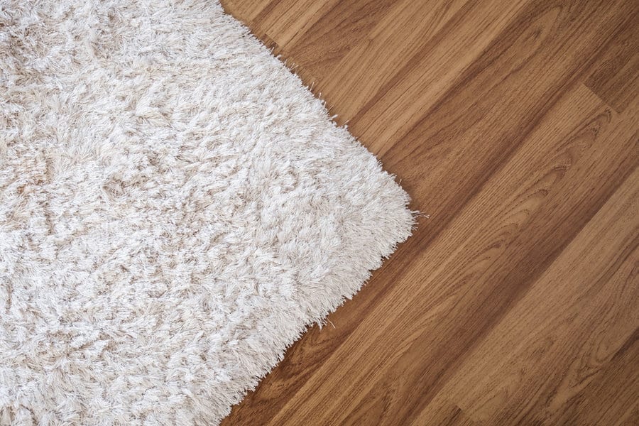 Close-up,White,Carpet,On,Laminate,Wood,Floor,In,Living,Room,