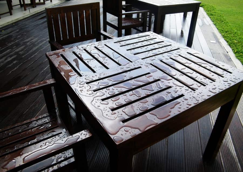 Wet wood furniture in backyard