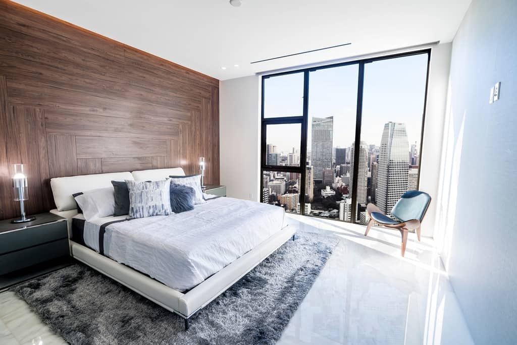 luxurious bedroom with wooden accent wall